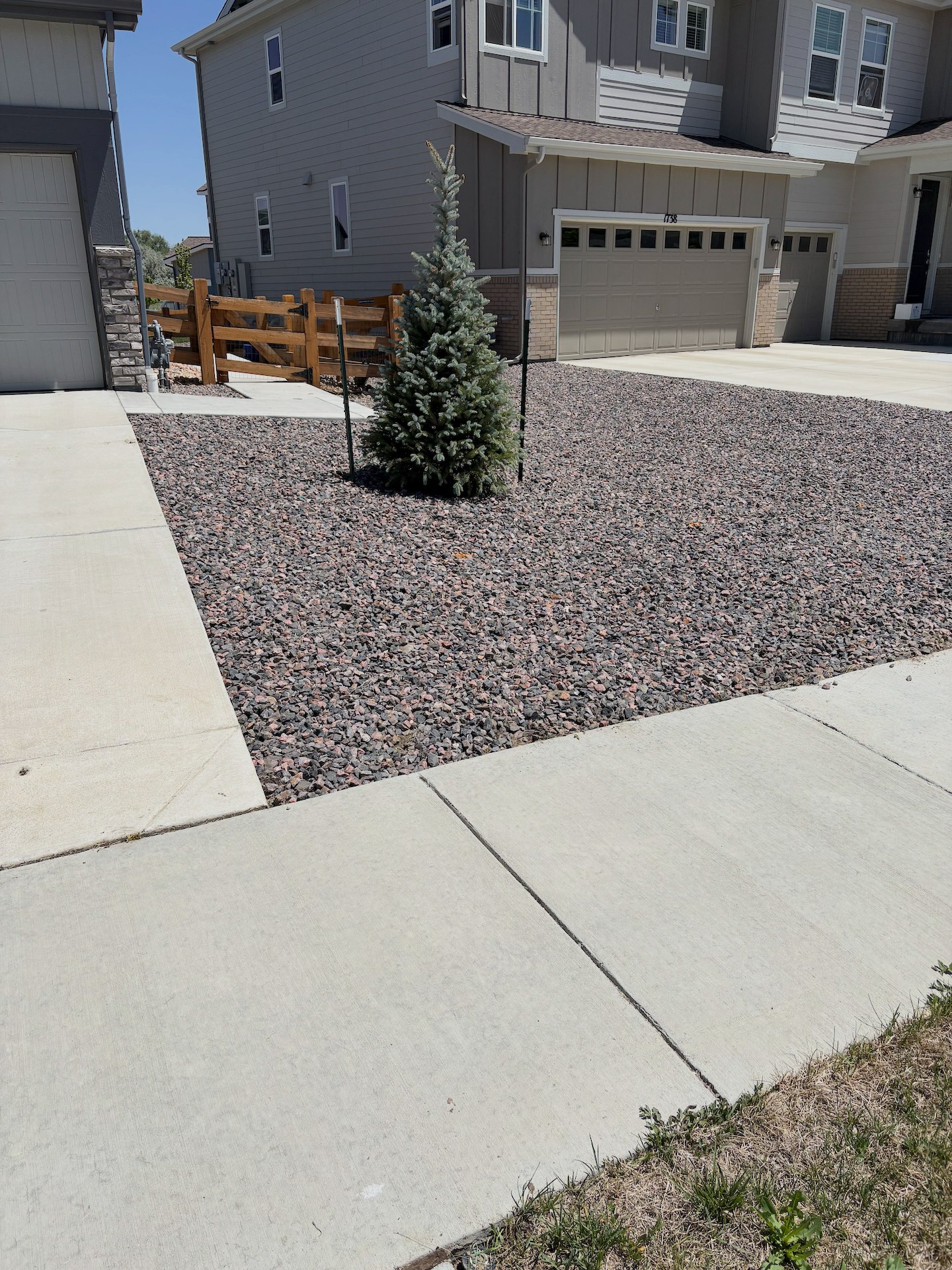 Weed-free front yard with professional rock landscaping